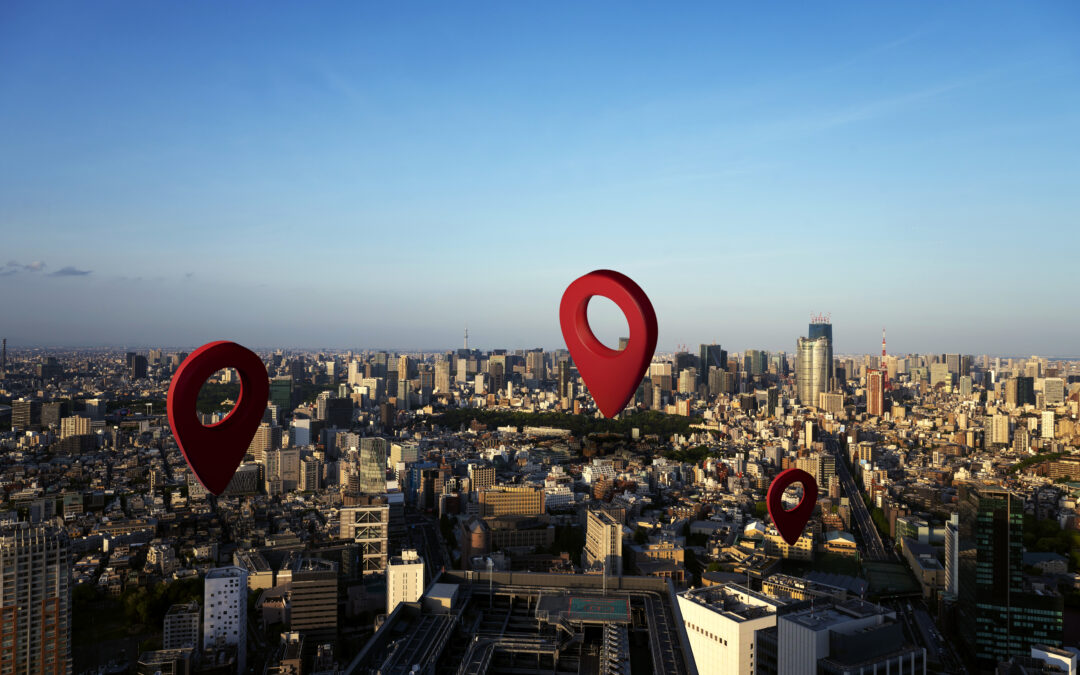 Buildings with red pin points above them representing local SEO.